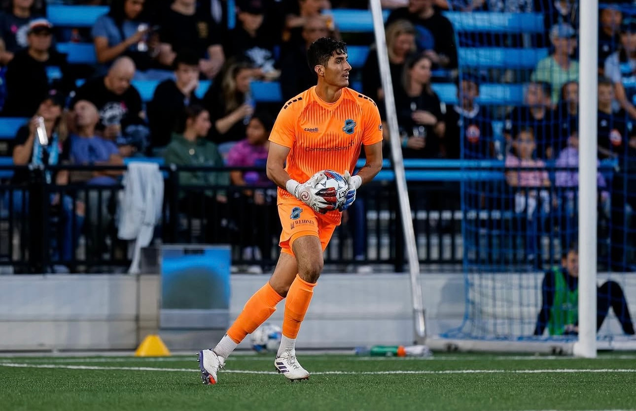 Christian Herrera holding the ball